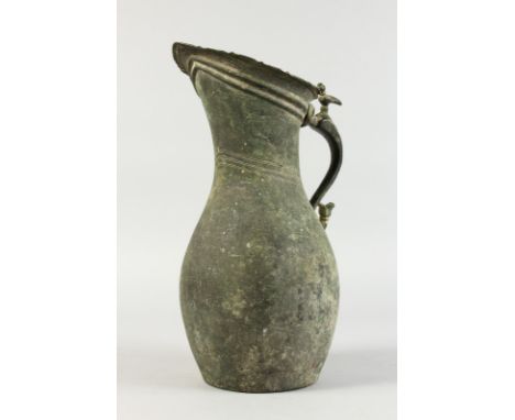 A 10TH-11TH CENTURY BRONZE EWER. 14ins high.