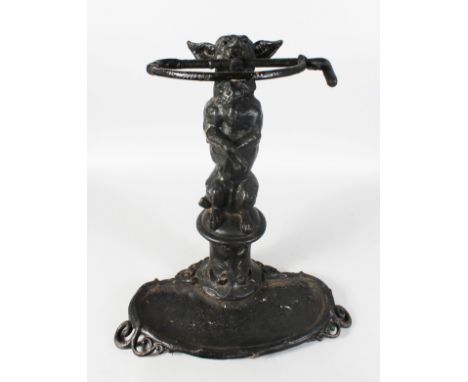 A GOOD 19TH CENTURY CAST IRON STICK STAND, modelled as a dog on his hind legs with a whip in it's mouth. 24ins high.