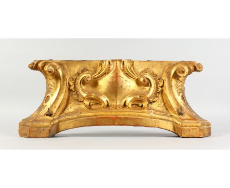 A 19TH CENTURY ITALIAN CARVED WOOD AND GILDED BRACKET. 25ins long x 10.5ins high.