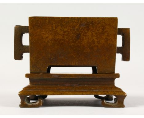 A GOOD CHINESE BRONZE TWO-HANDLED CENSER ON STAND. 5ins long.