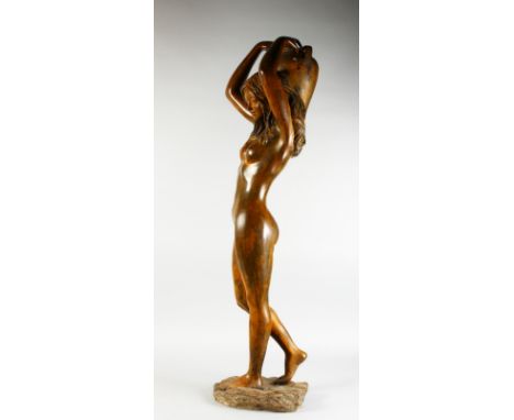 A GOOD LARGE BRONZE STANDING NUDE, carrying an urn. 4ft 2ins high.