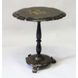A VICTORIAN PAPIER MACHE OVAL TOP TABLE, inlaid with mother-of-pearl, on a centre column and
