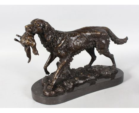 AFTER LOUIS-ALBERT CARVIN. A SETTER CARRYING A DUCK. Patinated bronze on a marble base. Signed. 12ins x 18ins.