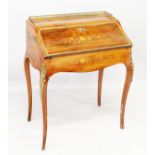 A LADIES FRENCH KINGWOOD AND MARQUETRY BUREAU with brass gallery, shaped fall front with fitted