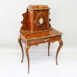 A GOOD 19TH CENTURY FRENCH KINGWOOD WRITING DESK, the top with a panel door inset with a Sevres
