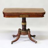 A GOOD REGENCY ROSEWOOD INLAID CARD TABLE with brass inlay, velvet interior on a central pillar,
