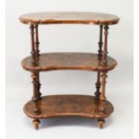 A VICTORIAN KIDNEY SHAPED THREE TIER WHAT-NOT, with turned supports on tapering legs. 3ft high x 2ft