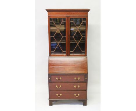 A GEORGIAN STYLE MAHOGANY BUREAU BOOKCASE, glazed doors to the top over a bureau base, on bracket feet. 6ft 2ins high x 2ft i