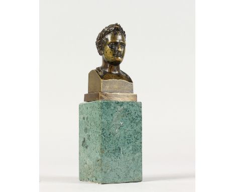 A SMALL BRONZE BUST OF CERES on a marble plinth. 6ins high.