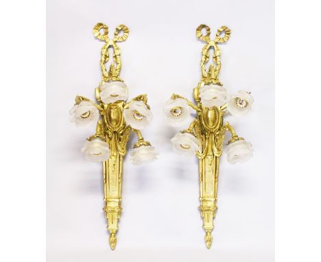 A GOOD LARGE PAIR OF CAST BRONZE FIVE-LIGHT WALL SCONCES, with scrolling arms and rose glass holders and ribbon motifs. 3ft l