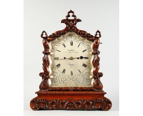 A VERY GOOD CARVED OAK CASED BRACKET CLOCK by E. J. DENT, 34 Royal Exchange, London 1234, with eight-day striking movement an