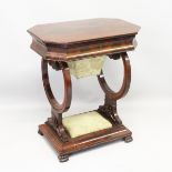 AN EMPIRE MAHOGANY WORK BOX with cut off corners, rising top with fitted interior, sewing bag below,