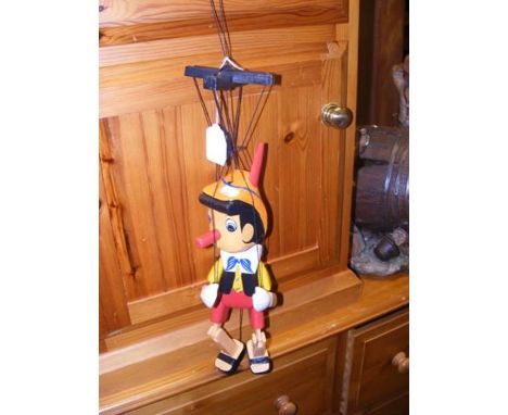 A vintage wooden Pinocchio puppet 
