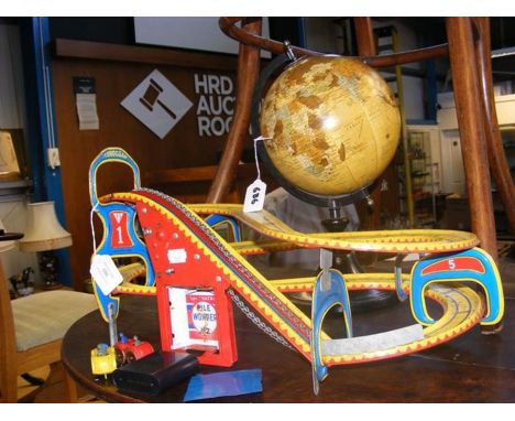 A vintage tin Pile Wonder roller-coaster, together with an office globe   