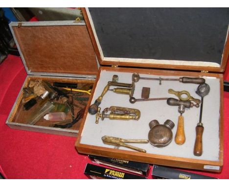 A collection of antique ammunition making tools