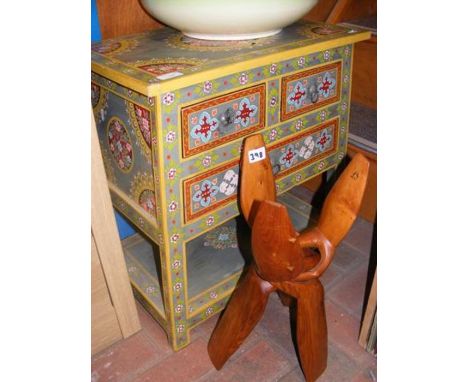 An Indian style painted occasional table, together with carved wood item 