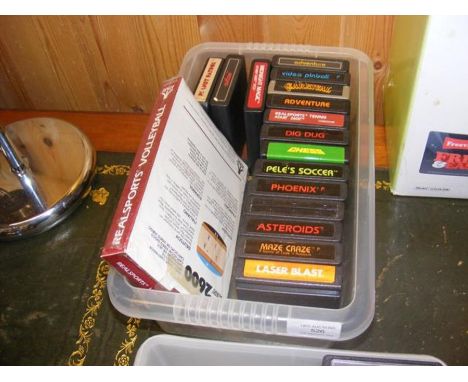 Seventeen Atari 2600 games cartridges, including Real Sports Volleyball and Midnight Magic 