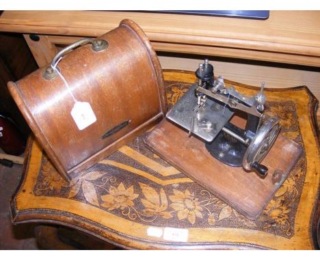 A vintage Lead sewing machine in carrying case 