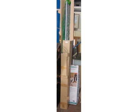 A rotary washing line together with Bergman electric weeder
