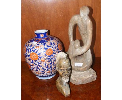 A stone freeform statue together with tribal bust and Chinese vase