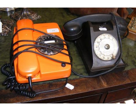 A vintage Siemens orange telephone and one other