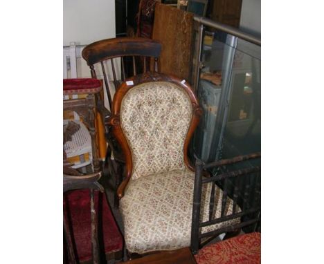 A country stick back armchair together with button back easy chair on castors