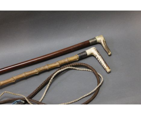 Two riding crops, one with antler handle, silver coloured collar and malacca shaft, thong and whip section, length excluding 