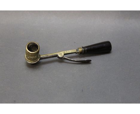 Powder measure, brass with wooden handle, stamped "D&B Patent".  For a similar model please see Cartridges Tools by DJ Baker,