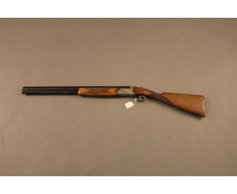 Lincoln 12 bore over/under shotgun, 26" barrels, 1/2 and 1/4 choke, 76 mm chambers, action engraved with hunting dogs and wil