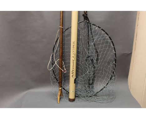 Extending bowheaded landing net, wading stick with antler handle and rod tube. 