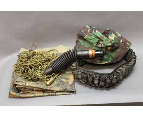 Camouflage cartridge belt, DPM hat, brass priest, paracord, waterproof camouflage material and Scotch game call. 