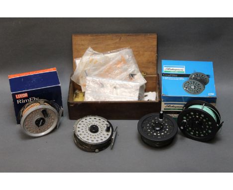 Three trout fly reels, Leeda rim fly, 3 1/2", Shakespeare Graphlite 2755 with spare spool and Kassnar Model FL-0461, and a bo