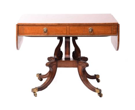 A possibly Scottish George IV rosewood crossbanded mahogany sofa table fitted with two deep frieze drawers with ornate gilt b