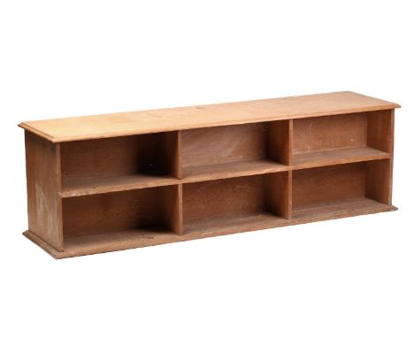 An Arts &amp; Crafts style oak double-sided low set of bookshelves, rectangular moulded top, c.1925, 57 cm high x 186 cm x 48