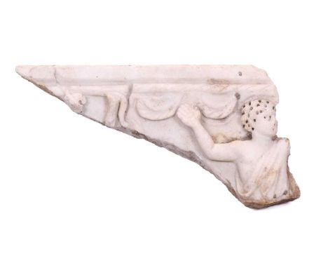 A Roman Marble fragment, 2nd/3rd century AD, possibly part of a sarcophagus, depicitng a youth in robes with arm raised, 36cm