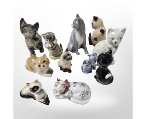 A group of porcelain cat ornaments, including Belleek, John Beswick, Goebel, etc, tallest 11cm.