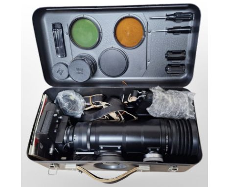 A Zenit 12S camera, No. 87125548, marked 'Made in USSR', with Tair-3S 4.5/300 lens, Helios-44M-4 2/58 lens, two lens filters,