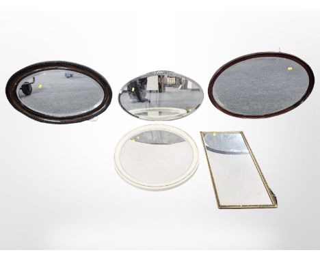 An Art Deco chrome framed oval mirror, length 69 cm and four further mirrors 