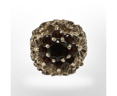 A 9ct gold garnet cluster ring, size K. CONDITION REPORT: 4.3g.
