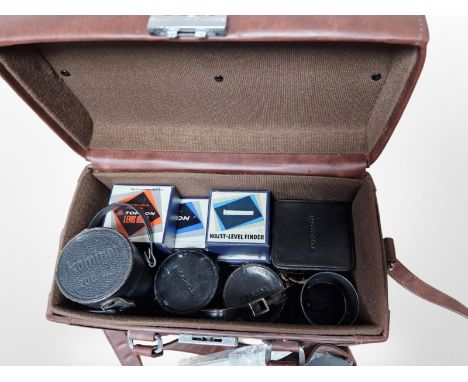 A camera bag containing Kominar 1:4.5 200mm lens, Topcon 1:3.5 F=135mm lens, a Kogaku 1:3.5 F=2.5cm lens, further Kogaku 1:2.
