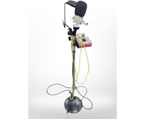 A TC Helicon perform guitar effects switch, mounted on stand with a Behringer C-3 microphone and two further microphones. 
