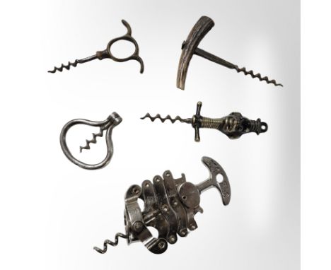 A zigzag corkscrew, a further lacquered brass corkscrew depicting a monkey, an antler handled example and two others. 