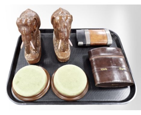 A pair of carved wooden elephants, stitched leather whiskey and cognac case containing two glass bottles, a modern hip flask 