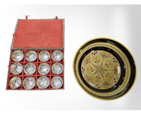 A boxed set of twelve Chinese cups and a French Quimper bowl.