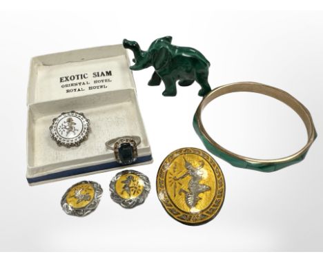 A carved malachite elephant and bangle, together with Siam silver and enamel brooch, three clip earrings and a white metal dr