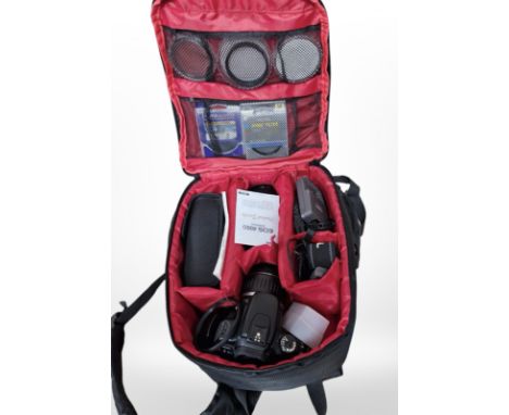 A Canon 400D digital camera, with Canon zoom lens EF-S 18-55mm, in camera bag with instructions, charger, Canon Speedlite 430