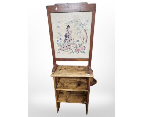 A rustic pine low shelf and an oak tapestry fire screen 