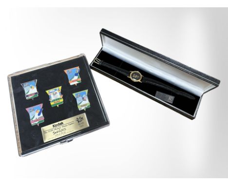 A Kodak 1998 Olympic Winter Games set of enamelled lapel pins, together with a further Kodak Olympic quartz wristwatch, and a