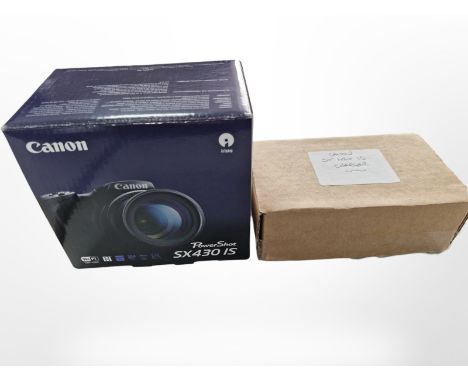 A Canon Powershot SX430 IS digital camera with HD 20mp lens, boxed with instructions, charger, etc. 