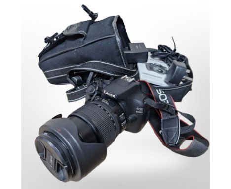 A Canon EOS 1200D digital camera, with Canon zoom lens EF-S 15-85mm in Cobra carry bag, with instructions, charger and batter